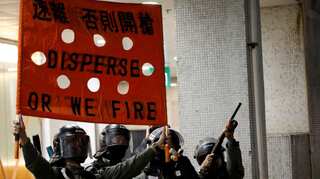 Huge Hong Kong rally after student dies and lawmakers arrested