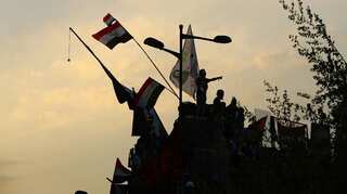 Iraqi security forces break up protests in Baghdad's main bridges