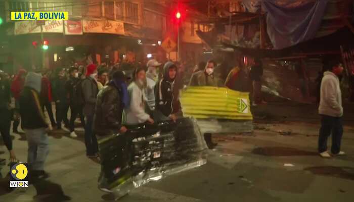 Tear gas flies in Bolivia as angry protests erupt overnight for Morales' resignation