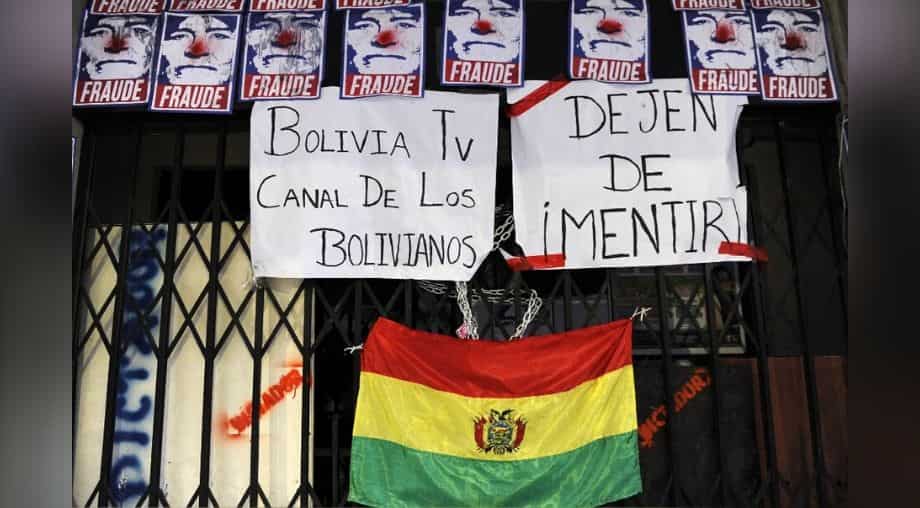 Protesters seize state-run media in Bolivia as tensions soar