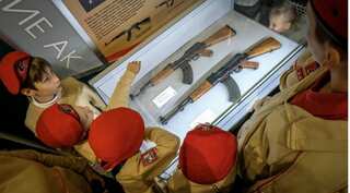 Students learn to assemble AK-47 rifles as Russia marks Kalashnikov's centenary