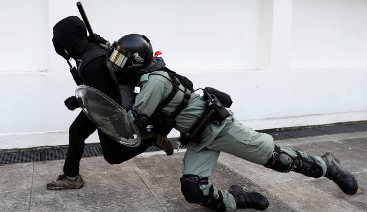 Hong Kong police opens fire at protesters; at least 2 injured