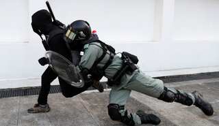 Hong Kong police opens fire at protesters; at least 2 injured
