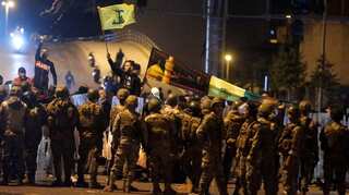 Dozens hurt in Lebanon clashes as demonstrators dig in