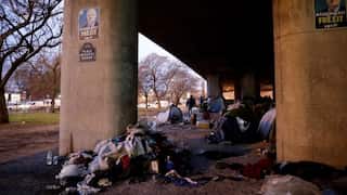 Police stop protesters approaching Trump motorcade in Paris