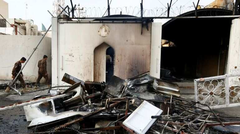 Iraq protesters burn shrine entrance in holy city, PM quitting 'not enough' Iraq protesters burn shrine entrance in holy city, PM quitting 'not enough'