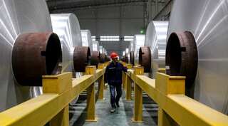 China's factory activity unexpectedly returns to growth in November