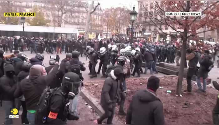 Fires, tear gas and clashes in Paris protests against pension reforms