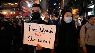 Hong Kong unrest: Fire and petrol bombs reported after 'generally peaceful' march