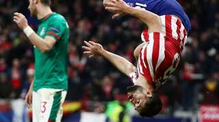 Atletico Madrid stroll into Champions League knockouts