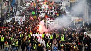 Hundreds of thousands protest in France over pension reform plans