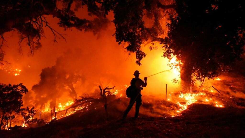Thousands evacuated as California wildfires double in size