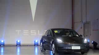 Tesla begins deliveries of China-made Model 3 cars