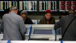 Global Markets: Asian shares lower as investors book decade-end profits