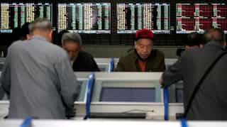 Global Markets: Asian shares lower as investors book decade-end profits