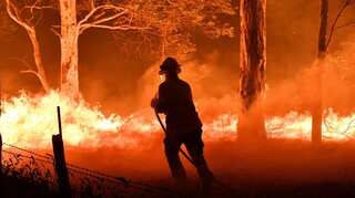 Thousands flee fires in Australia, navy helps evacuate the stranded