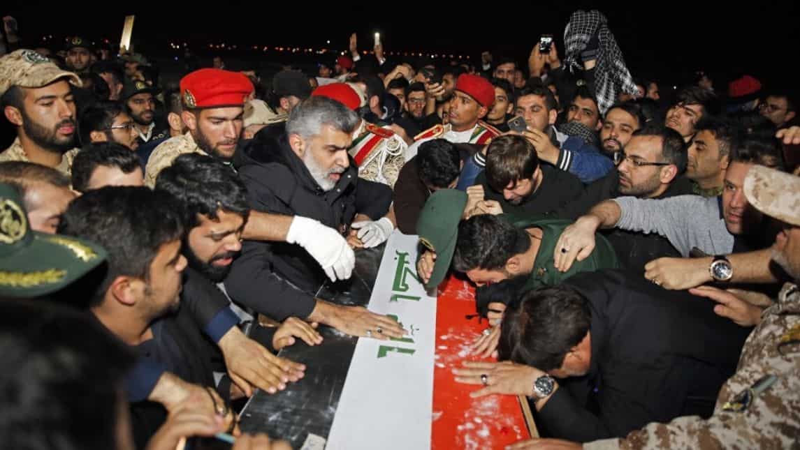 Mourners carry Soleimani's coffin