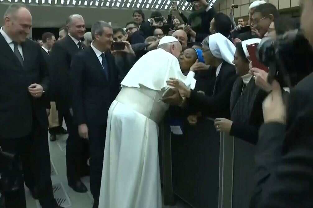 'Don't bite,' says Pope Francis after agreeing to kiss a nun