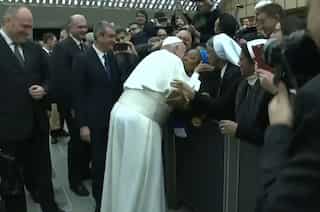 'Don't bite,' says Pope Francis after agreeing to kiss a nun