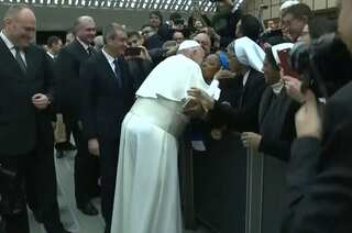 'Don't bite,' says Pope Francis after agreeing to kiss a nun