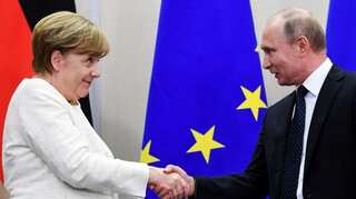 Libya and Iran top agenda in Merkel-Putin meeting