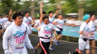 Thousands join Thai anti-government run as political climate simmers