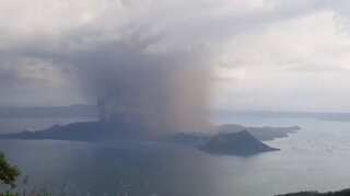 Philippines suspends Manila airport flights as volcano spews ash