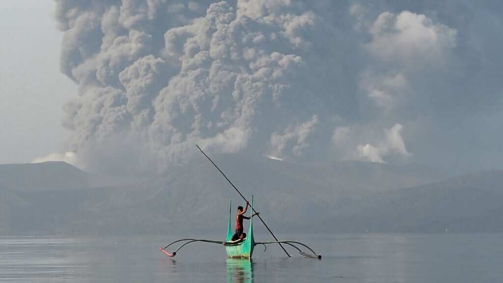 Tens of thousands face uncertainty as Philippine volcano spews lava