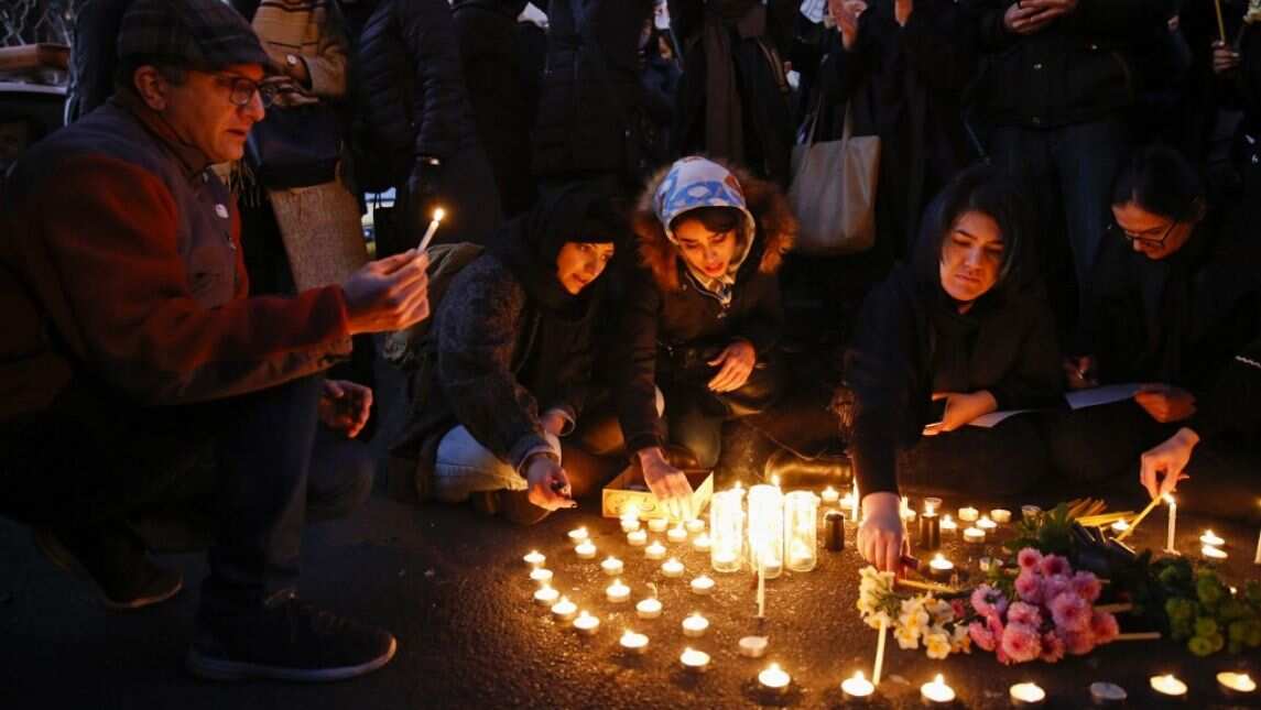 Iranians light candles