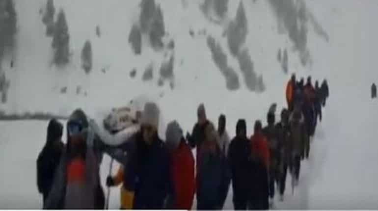 Policemen, villagers carry sick policeman in Lahaul-Spiti for 7 km Policemen, villagers carry sick policeman in Lahaul-Spiti for 7 km