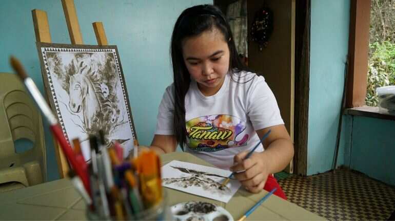 Philippine artist paints images of volcanic devastation using ash