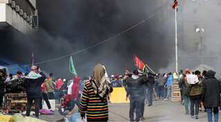Iraqi security forces raid Baghdad's main protest camp, shoot at demonstrators