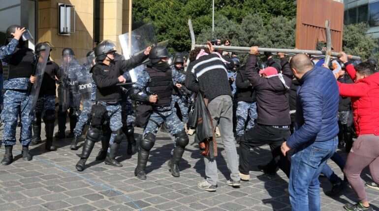 Lebanese protesters throw rocks at police near parliament Lebanese protesters throw rocks at police near parliament