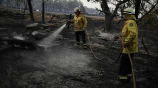 Bushfire smoke blows into Australia's capital as fire threat eases