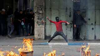 At least two Palestinians killed, 16 Israelis hurt in violence over Trump plan