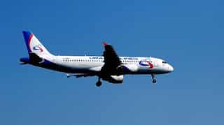 Passenger plane makes emergency landing after coming under fire in Syria