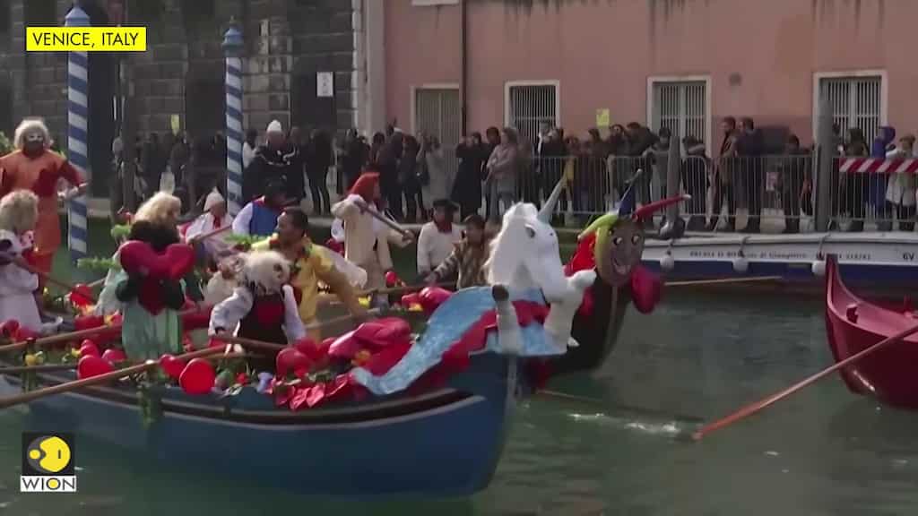 Venice comes alive with colourful characters in carnival boat parade