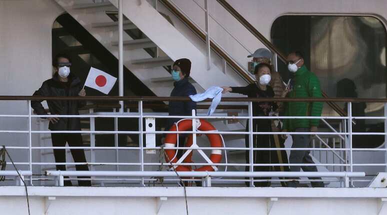 Crew leaves Japan virus-hit ship for new quarantine