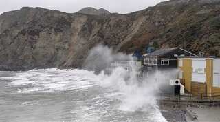 Storm Dennis: One person dies as heavy flooding and high winds hit UK