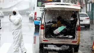 Chinese tourist dies in France as coronavirus cases show slight decline