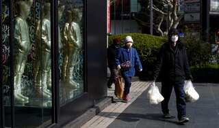 China virus epicentre eases travel curbs as cases fall