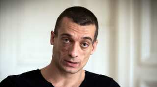 Russian activist, girlfriend held after leaked sex videos that ended Macron ally's campaign
