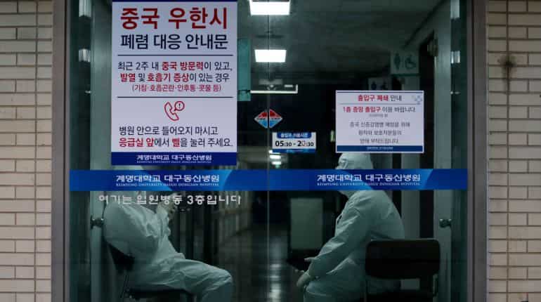 South Korea raises alert to highest level as coronavirus cases jump