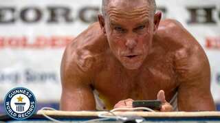 Former Marine George Hood breaks plank world record at 62