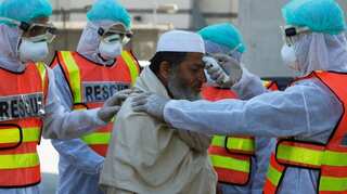 Pakistan suspends international flights for two weeks to contain COVID-19