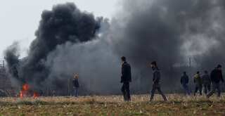 Greek police fire tear gas at migrants on Turkish border