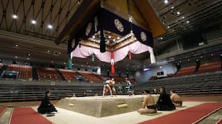 Japan's sumo wrestlers face off for spring tournament in front of empty seats