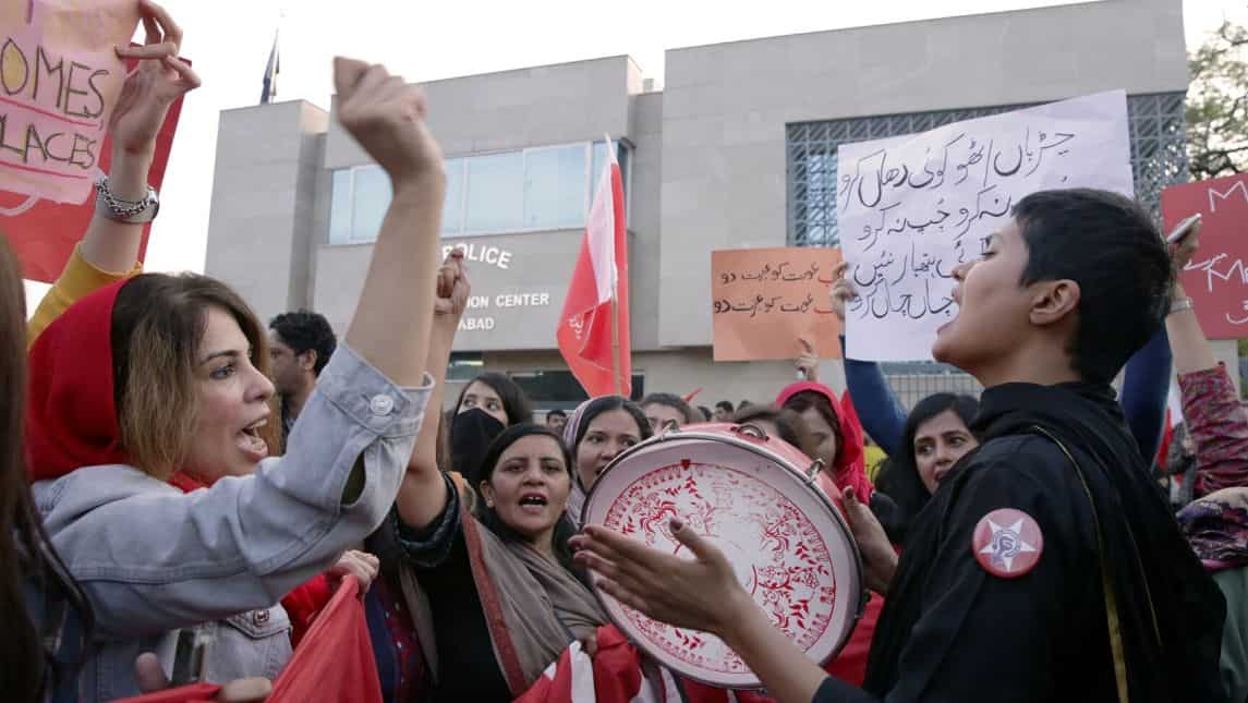 Women singing songs at the site