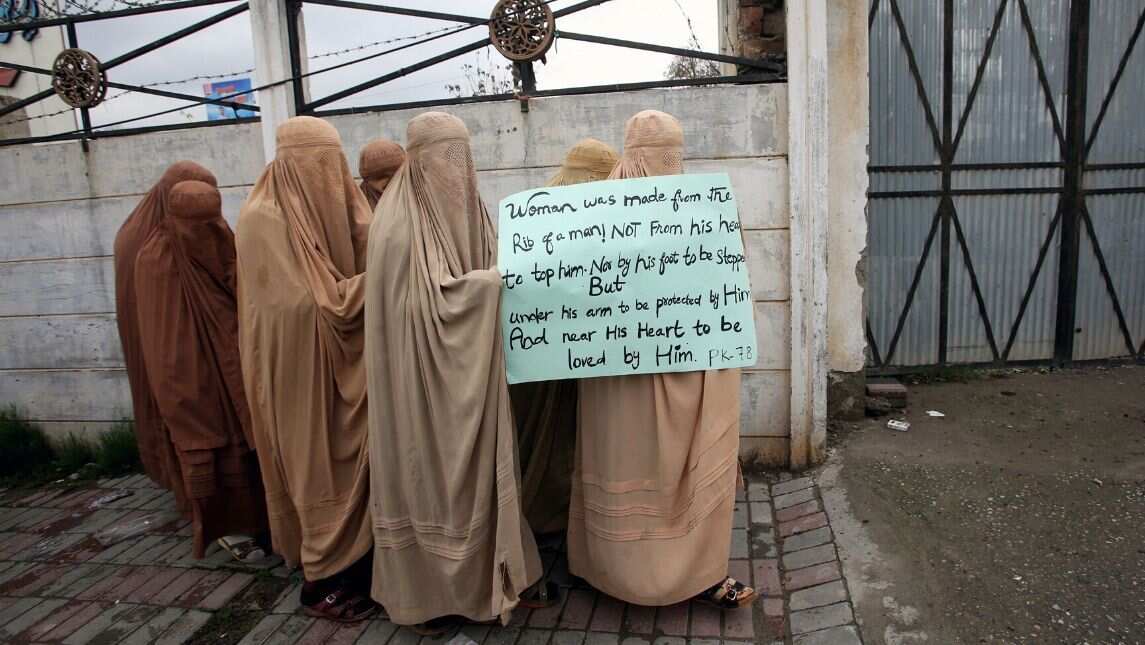 JUI-F clad women in burkas at the protest