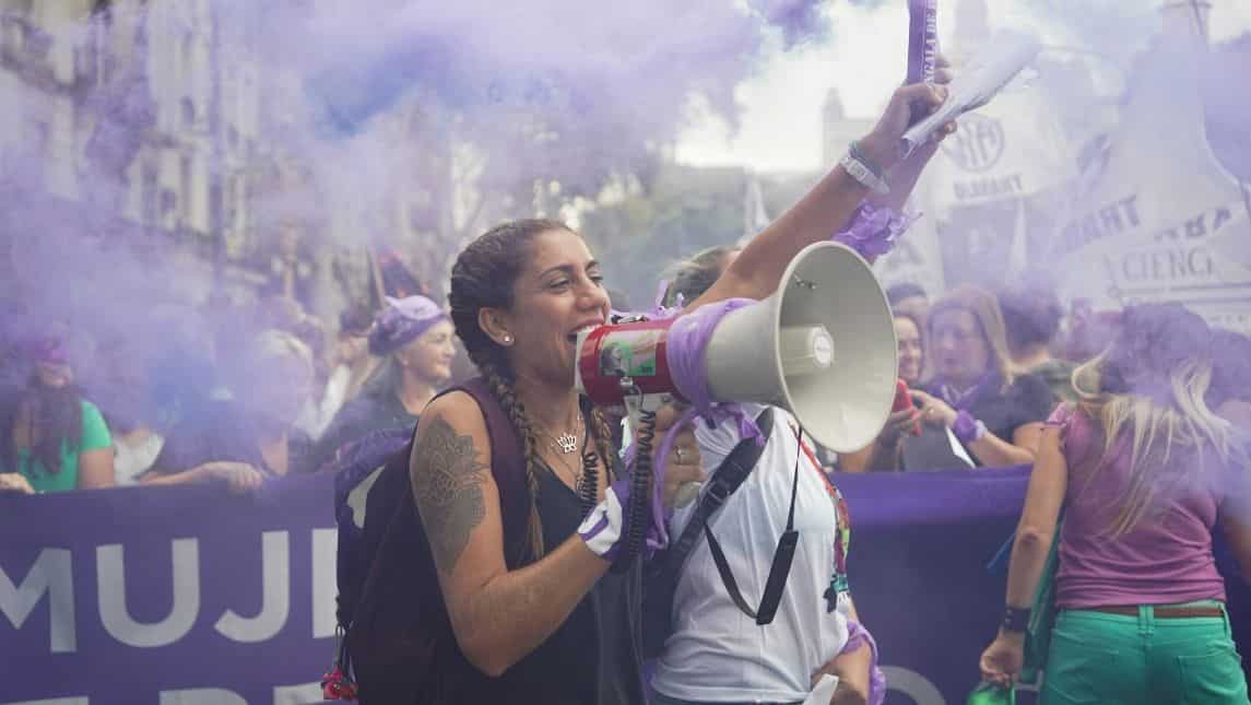 A woman uses a megaphone during a demonstration